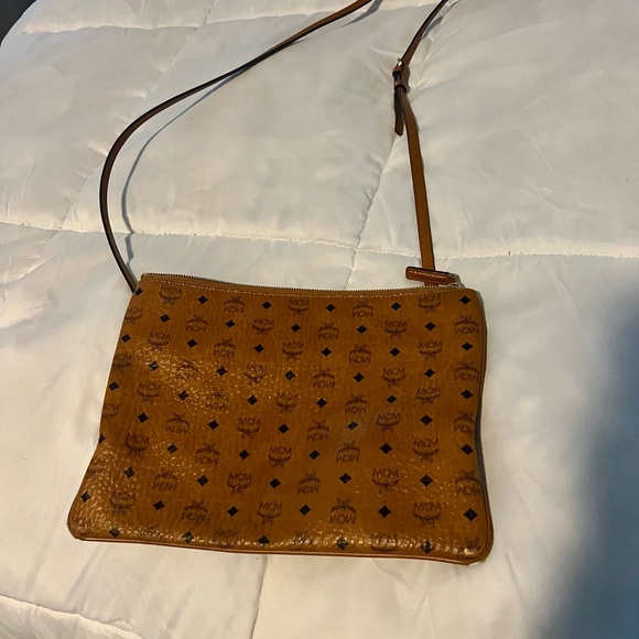 MCM crossbody has some wear in the bottom corners, not visible while wearing. - Picture 2 of 6